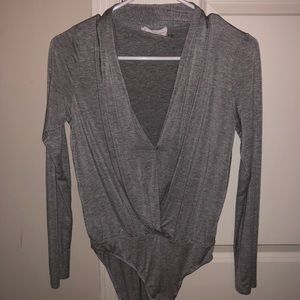 Gray bodysuit deep v neck and never worn!